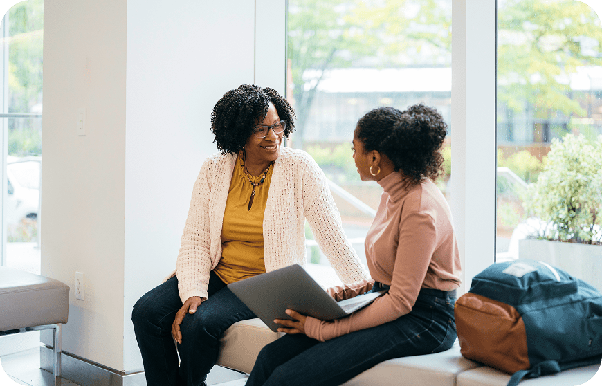 Conversation between two women indoors